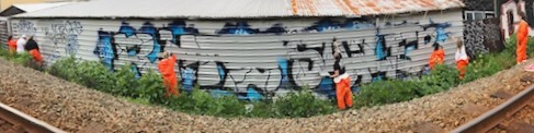 Graffiti on a building beside the railway line