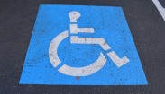 Photo of a mobility park icon painted on a carpark
